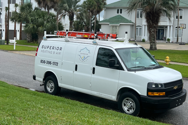 Heating technician working on furnace in Navarre, FL